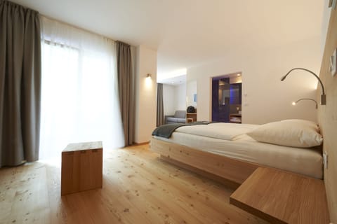 Junior Suite, Balcony | In-room safe, desk, free WiFi, bed sheets