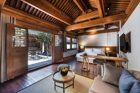 Deluxe Double Room, Courtyard View | Living area | TV