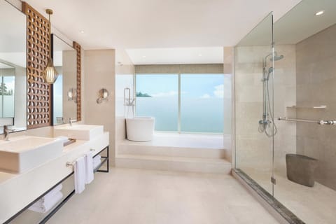 Separate tub and shower, rainfall showerhead, designer toiletries