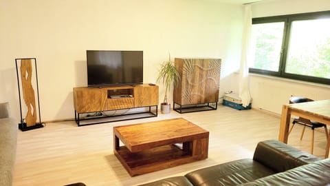 Apartment | Living area | 42-inch flat-screen TV with cable channels, TV, DVD player