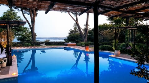 Seasonal outdoor pool, open 11:00 AM to 7:00 PM, pool umbrellas