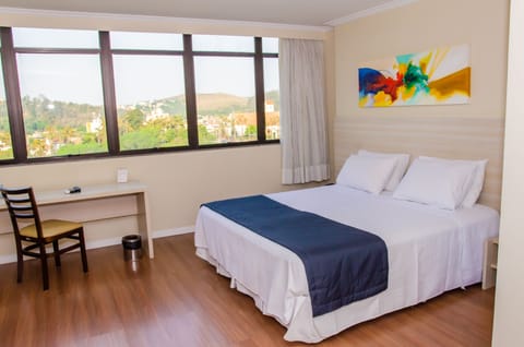 Standard Double Room | Minibar, in-room safe, desk, blackout drapes