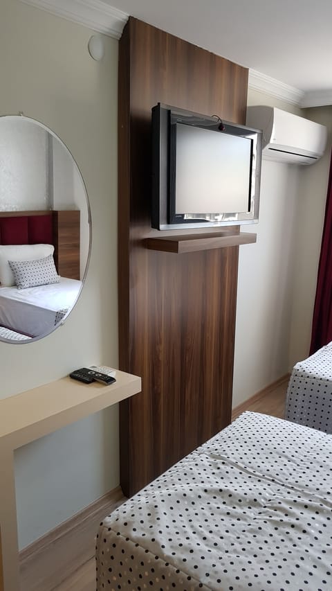 Triple Room, City View | Premium bedding, minibar, in-room safe, soundproofing