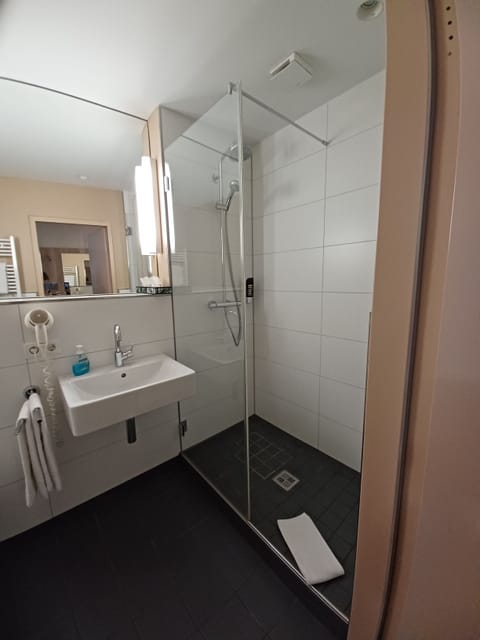 Shower, free toiletries, hair dryer, slippers