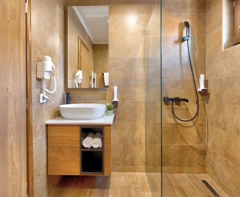 Shower, free toiletries, hair dryer, slippers