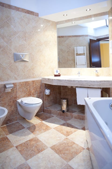 Junior Suite, Balcony | Bathroom | Combined shower/tub, deep soaking tub, rainfall showerhead