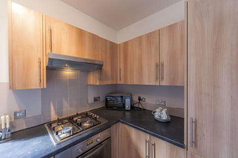 Family Apartment, 2 Bedrooms, Ground Floor | Private kitchen | Full-size fridge, microwave, oven, stovetop