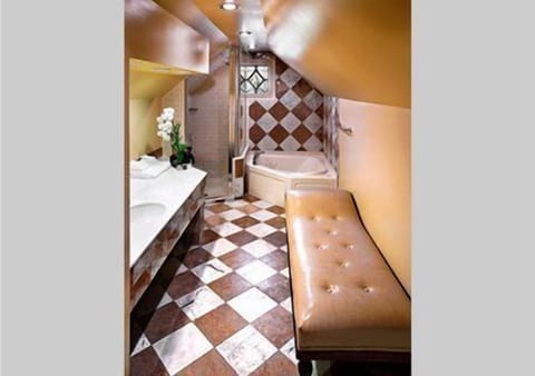 Combined shower/tub, designer toiletries, hair dryer, bathrobes