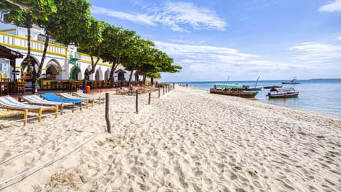 On the beach, sun loungers, beach towels