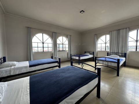 Basic Quadruple Room, Shared Bathroom | In-room safe, free WiFi, bed sheets