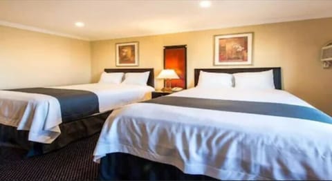 Family Room, 2 Queen Beds, Refrigerator & Microwave, City View | Desk, WiFi (free)