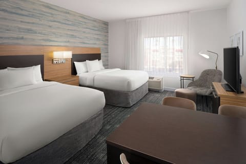 Hypo-allergenic bedding, desk, laptop workspace, blackout drapes