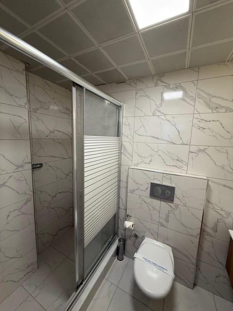 Family Triple Room | Bathroom | Shower, free toiletries, hair dryer, slippers