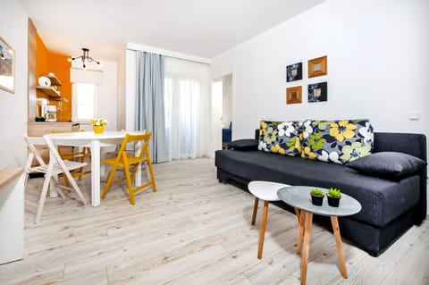 Apartment, 1 Bedroom | Living room | Flat-screen TV