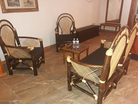 Suite, 1 King Bed | Living area | 32-inch flat-screen TV with satellite channels, TV