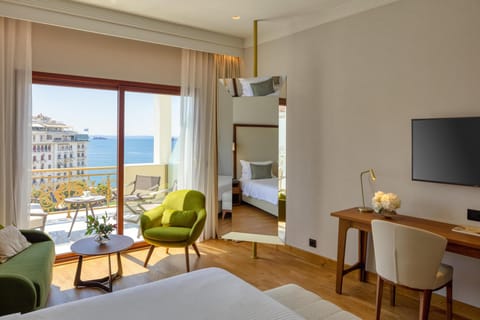 Executive Triple Room, Sea View | Premium bedding, minibar, in-room safe, desk