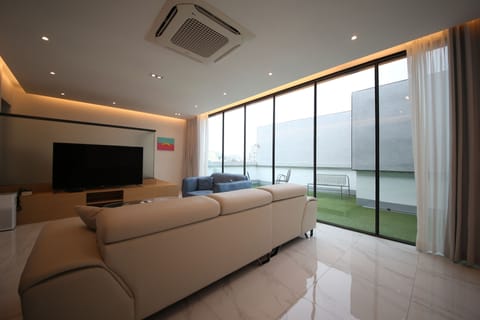 Rooftop Party Room | Down comforters, individually decorated, desk, blackout drapes