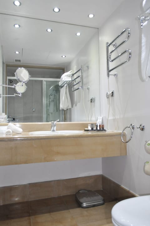 Deep soaking tub, designer toiletries, hair dryer, bathrobes