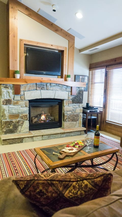 Condo, 1 Bedroom | Living area | Flat-screen TV, fireplace, DVD player