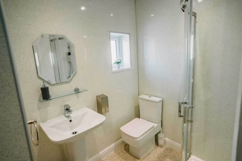 Shower, rainfall showerhead, hair dryer, towels