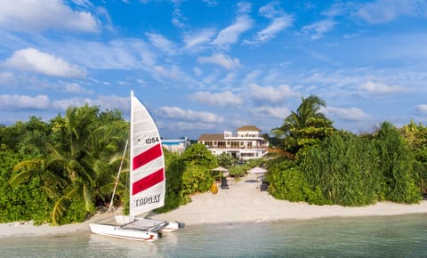 On the beach, white sand, sun loungers, beach umbrellas