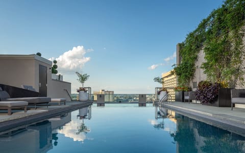 Seasonal outdoor pool, a heated pool, pool umbrellas, sun loungers