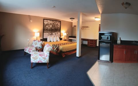 Desk, laptop workspace, blackout drapes, iron/ironing board