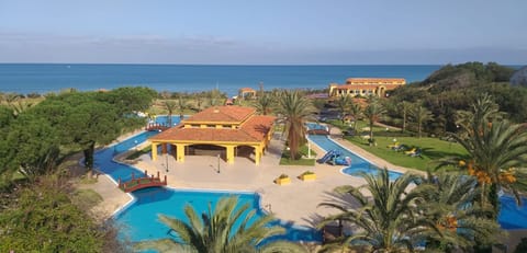 Indoor pool, outdoor pool, pool umbrellas, sun loungers