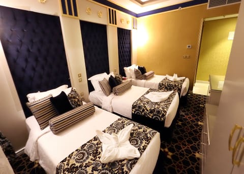 Standard Triple Room | Minibar, in-room safe, soundproofing, iron/ironing board (on request)