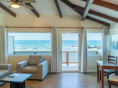 Triple Ocean View | Living area | Flat-screen TV
