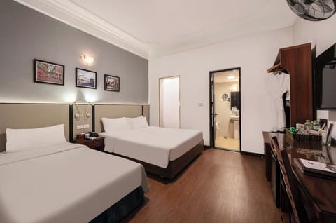 Family Room | Minibar, in-room safe, blackout drapes, iron/ironing board