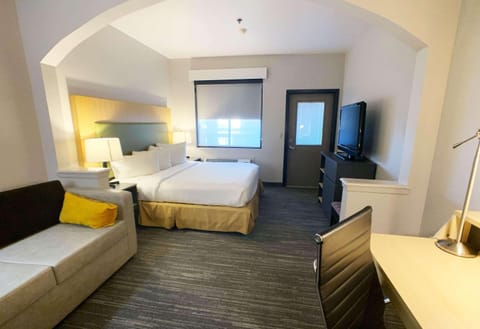 Desk, laptop workspace, blackout drapes, iron/ironing board