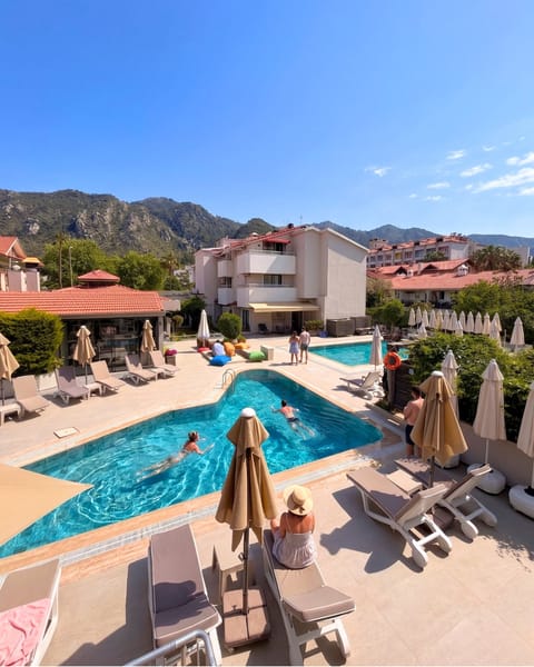 Seasonal outdoor pool, pool umbrellas, sun loungers