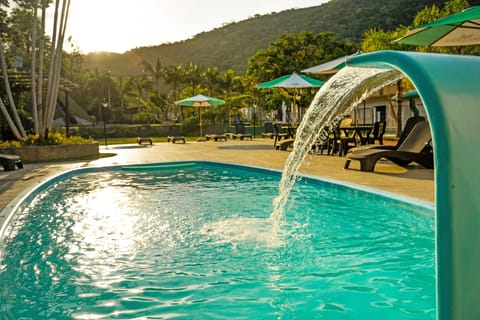 2 indoor pools, outdoor pool, open 9:00 AM to 8:00 PM, pool umbrellas