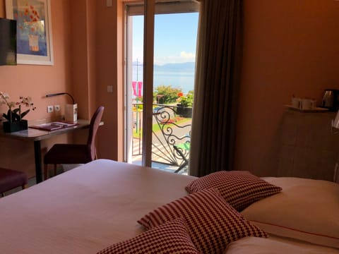 Double Room, Partial Lake View | Pillowtop beds, minibar, in-room safe, desk