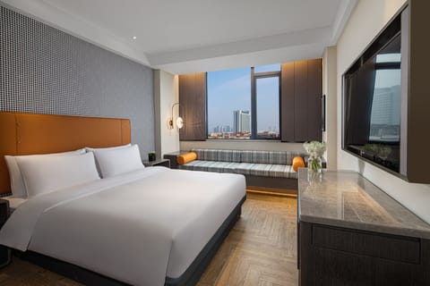 Executive Double Room | Down comforters, minibar, individually decorated, blackout drapes