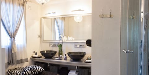 Suite, Balcony, Pool View | Bathroom | Shower, hydromassage showerhead, free toiletries, hair dryer