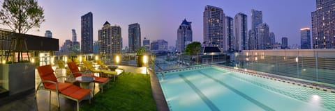 Outdoor pool, a rooftop pool, pool umbrellas