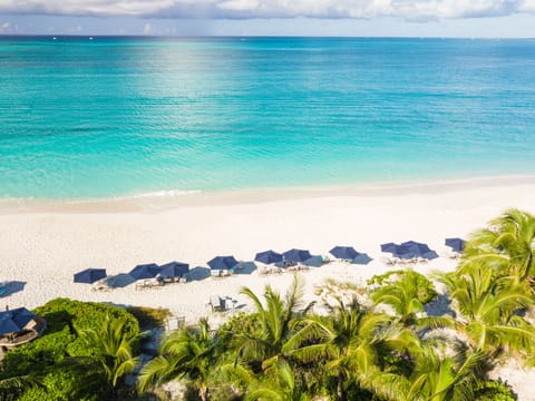 Beach nearby, white sand, sun loungers, beach umbrellas