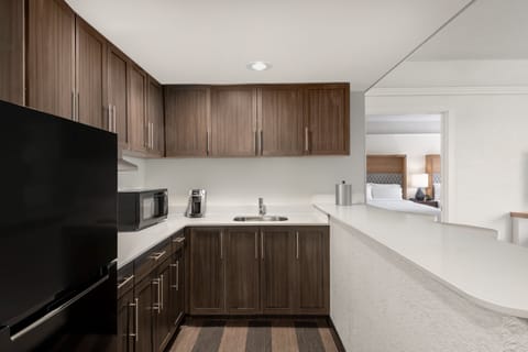 Hypo-allergenic bedding, desk, laptop workspace, blackout drapes