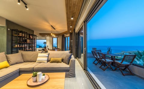 Villa, 3 Bedrooms, Sea View | Living area | 49-inch flat-screen TV with cable channels, TV, fireplace