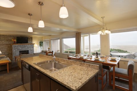 Family Suite, 3 Bedrooms, 2 Bathrooms, Oceanfront | Living area | 42-inch flat-screen TV with cable channels, books