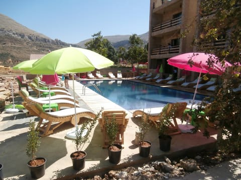 Seasonal outdoor pool, pool umbrellas, sun loungers
