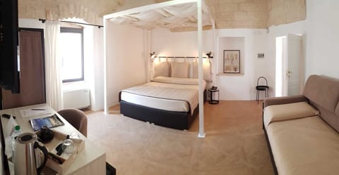 Standard Triple Room | Minibar, in-room safe, desk, blackout drapes