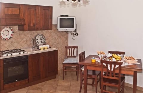 Family Apartment, 1 Bedroom | Private kitchen | Fridge, microwave, stovetop, coffee/tea maker