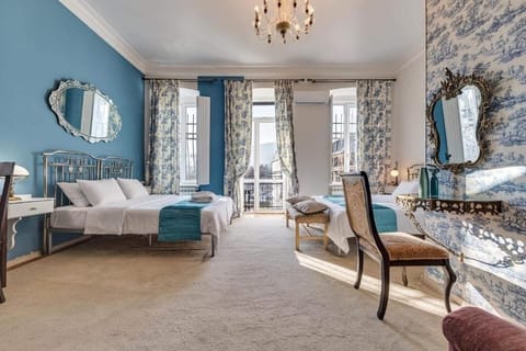 Exclusive Quadruple Room, Private Bathroom | 1 bedroom, minibar, blackout drapes, iron/ironing board