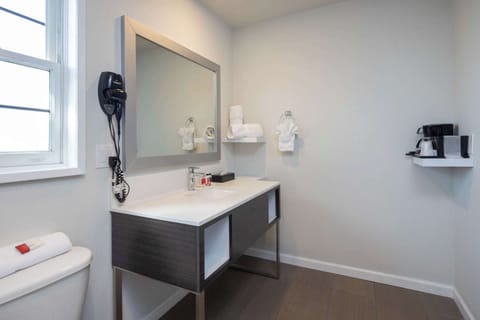 Premium bedding, desk, laptop workspace, iron/ironing board