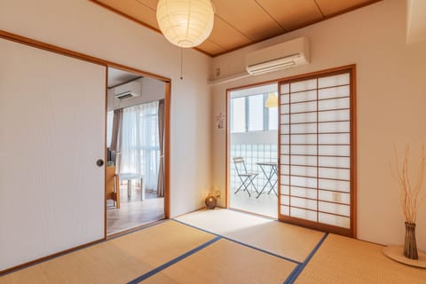 Family Apartment, 3 Bedrooms | Desk, laptop workspace, blackout drapes, iron/ironing board