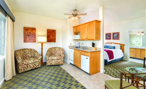Studio Suite, Kitchenette | Living area | 32-inch LED TV with cable channels, TV
