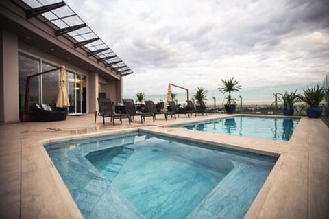 Outdoor pool, open 10:00 AM to 10:00 PM, sun loungers